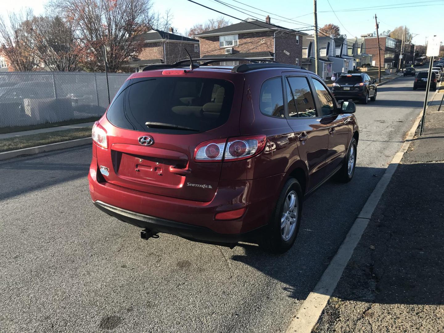 2011 Red /Tan Hyundai Santa Fe GLS 2.4 (5XYZG3AB8BG) with an 2.4L L4 DOHC 16V engine, 6-Speed Automatic transmission, located at 577 Chester Pike, Prospect Park, PA, 19076, (610) 237-1015, 39.886154, -75.302338 - 2011 Hyundai Santa Fe GL: Only 94k miles, new PA inspection, great on gas, runs LIKE NEW! This vehicle comes inspected and has been given a bumper to bumper safety check. It is very clean, reliable, and well maintained. We offer a unique pay plan that is known for being the easiest and fastest fi - Photo#5