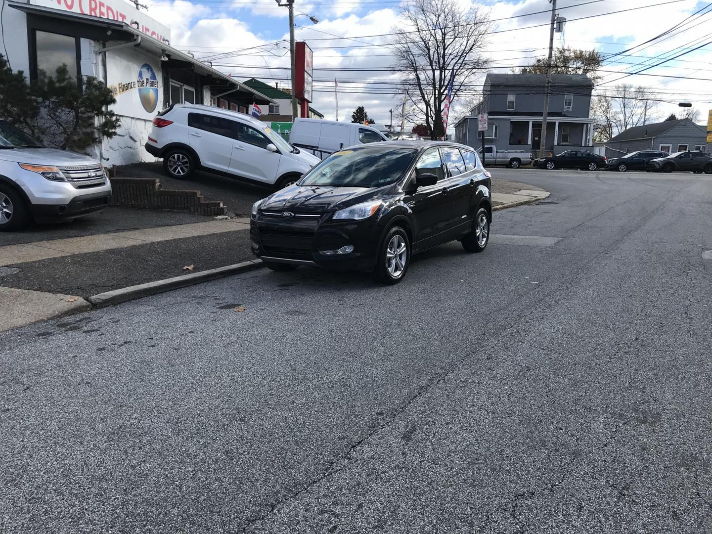 2013 Black /Gray Ford Escape SE (1FMCU0G99DU) with an 2.0L L4 DOHC 16V engine, 6-Speed Automatic transmission, located at 577 Chester Pike, Prospect Park, PA, 19076, (610) 237-1015, 39.886154, -75.302338 - Photo#1