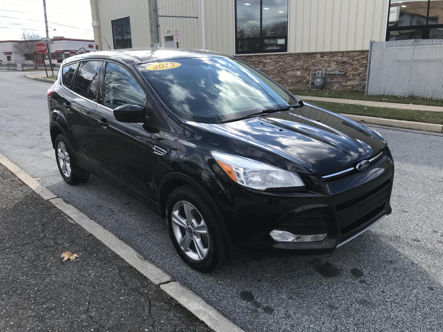 2013 Black /Gray Ford Escape SE (1FMCU0G99DU) with an 2.0L L4 DOHC 16V engine, 6-Speed Automatic transmission, located at 577 Chester Pike, Prospect Park, PA, 19076, (610) 237-1015, 39.886154, -75.302338 - Photo#3