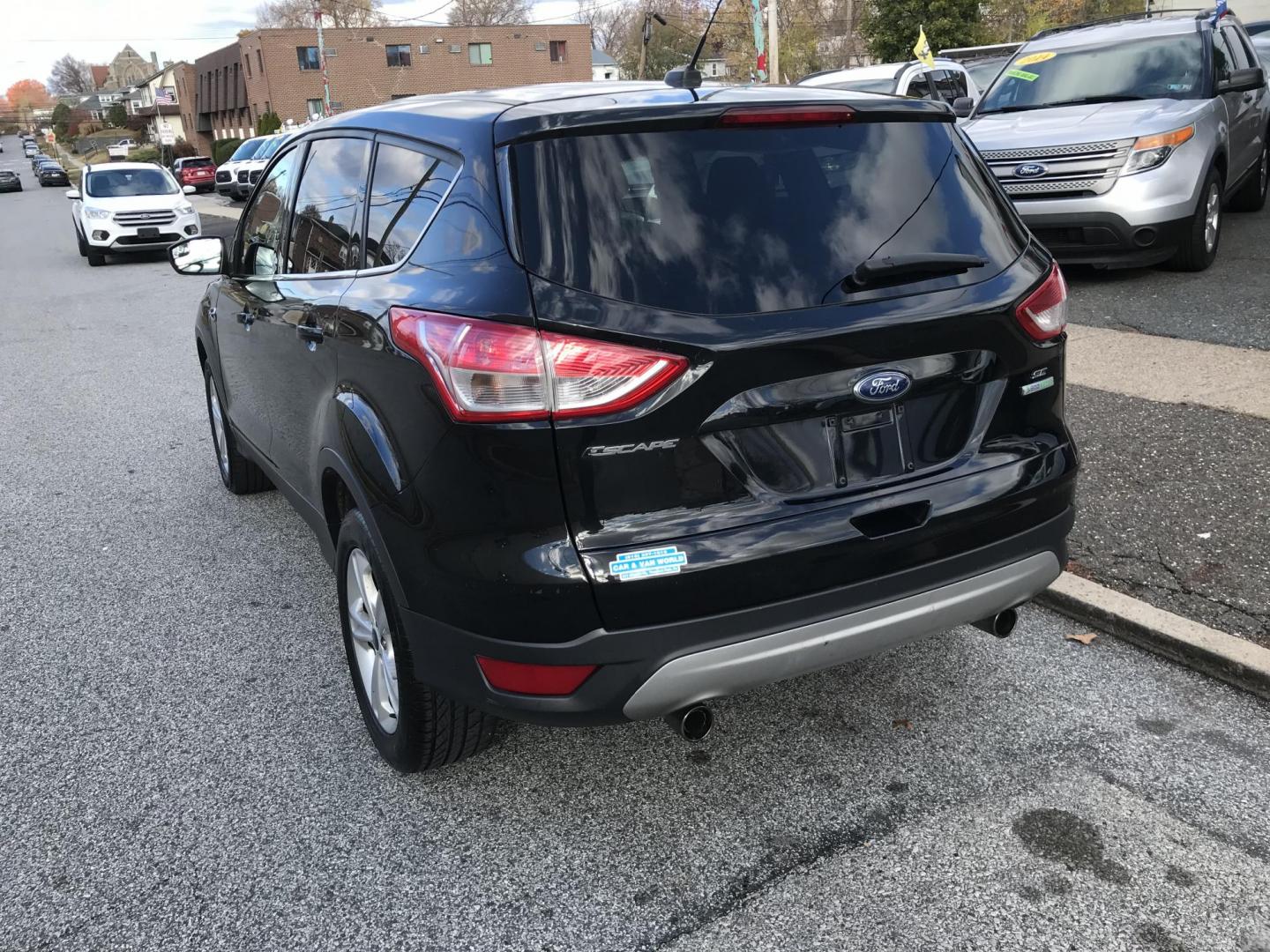 2013 Black /Gray Ford Escape SE (1FMCU0G99DU) with an 2.0L L4 DOHC 16V engine, 6-Speed Automatic transmission, located at 577 Chester Pike, Prospect Park, PA, 19076, (610) 237-1015, 39.886154, -75.302338 - Photo#4