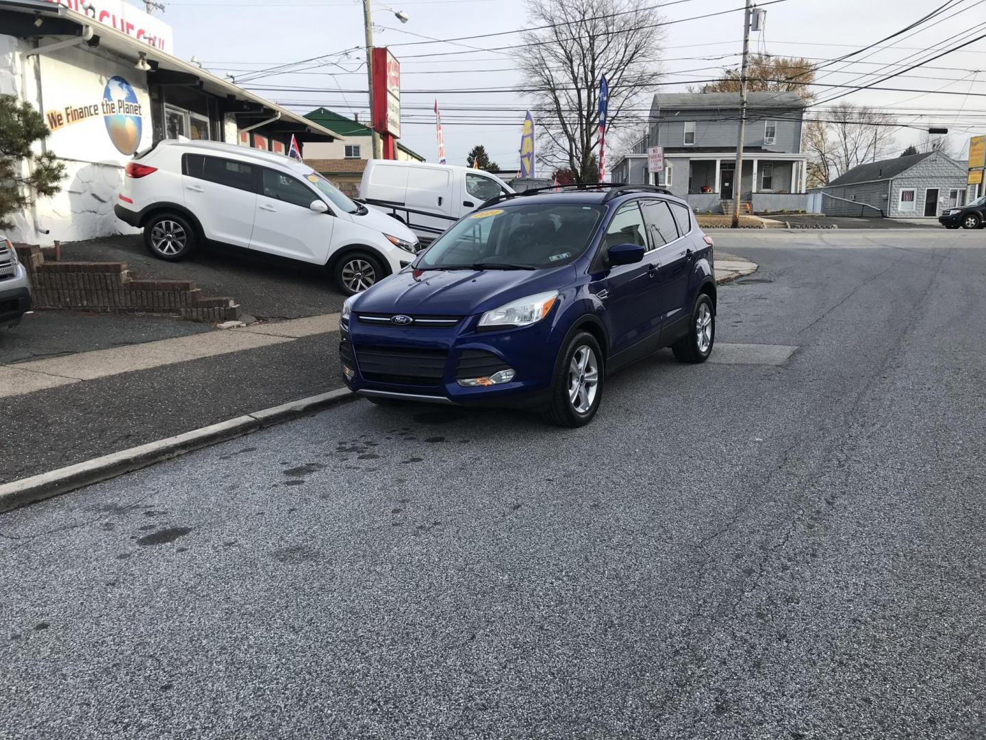 2014 Blue /Gray Ford Escape SE (1FMCU0GX7EU) with an 1.6L L4 DOHC 16V engine, 6-Speed Automatic transmission, located at 577 Chester Pike, Prospect Park, PA, 19076, (610) 237-1015, 39.886154, -75.302338 - 2014 Ford Escape SE: Only 93k miles, backup camera, new PA inspection, great on gas, looks and runs LIKE NEW! This vehicle comes inspected and has been given a bumper to bumper safety check. It is very clean, reliable, and well maintained. We offer a unique pay plan that is known for being the ea - Photo#1