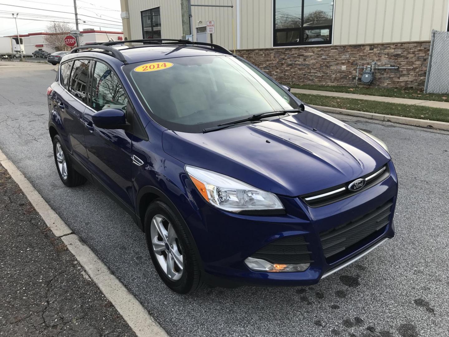 2014 Blue /Gray Ford Escape SE (1FMCU0GX7EU) with an 1.6L L4 DOHC 16V engine, 6-Speed Automatic transmission, located at 577 Chester Pike, Prospect Park, PA, 19076, (610) 237-1015, 39.886154, -75.302338 - 2014 Ford Escape SE: Only 93k miles, backup camera, new PA inspection, great on gas, looks and runs LIKE NEW! This vehicle comes inspected and has been given a bumper to bumper safety check. It is very clean, reliable, and well maintained. We offer a unique pay plan that is known for being the ea - Photo#3