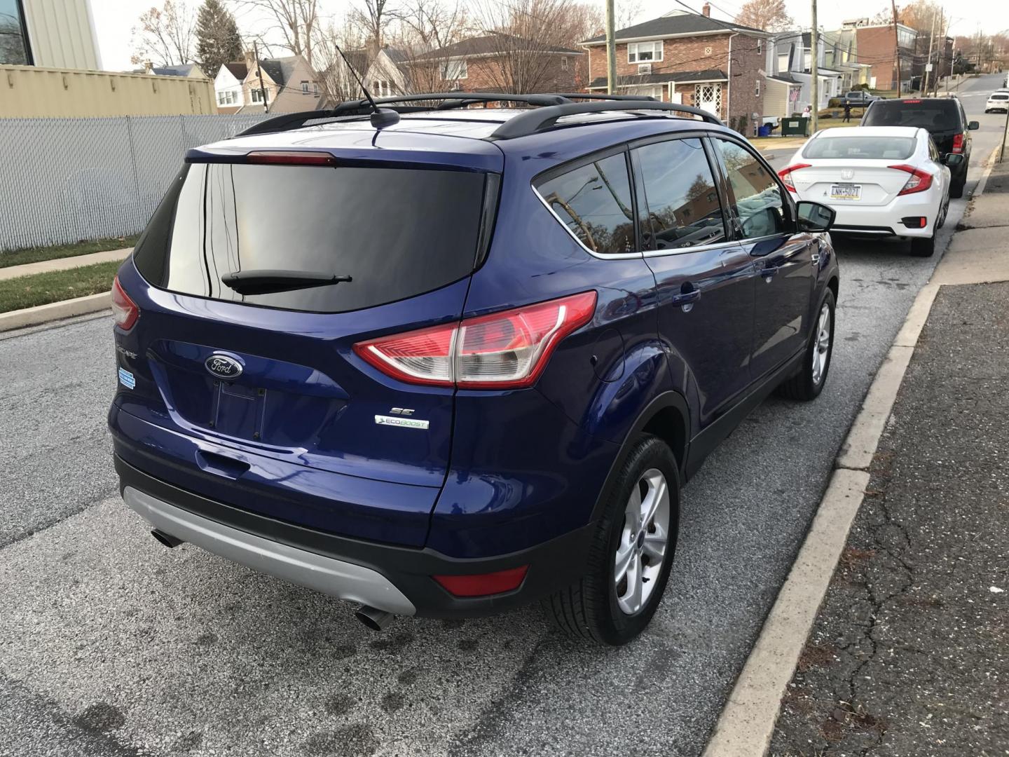 2014 Blue /Gray Ford Escape SE (1FMCU0GX7EU) with an 1.6L L4 DOHC 16V engine, 6-Speed Automatic transmission, located at 577 Chester Pike, Prospect Park, PA, 19076, (610) 237-1015, 39.886154, -75.302338 - 2014 Ford Escape SE: Only 93k miles, backup camera, new PA inspection, great on gas, looks and runs LIKE NEW! This vehicle comes inspected and has been given a bumper to bumper safety check. It is very clean, reliable, and well maintained. We offer a unique pay plan that is known for being the ea - Photo#4