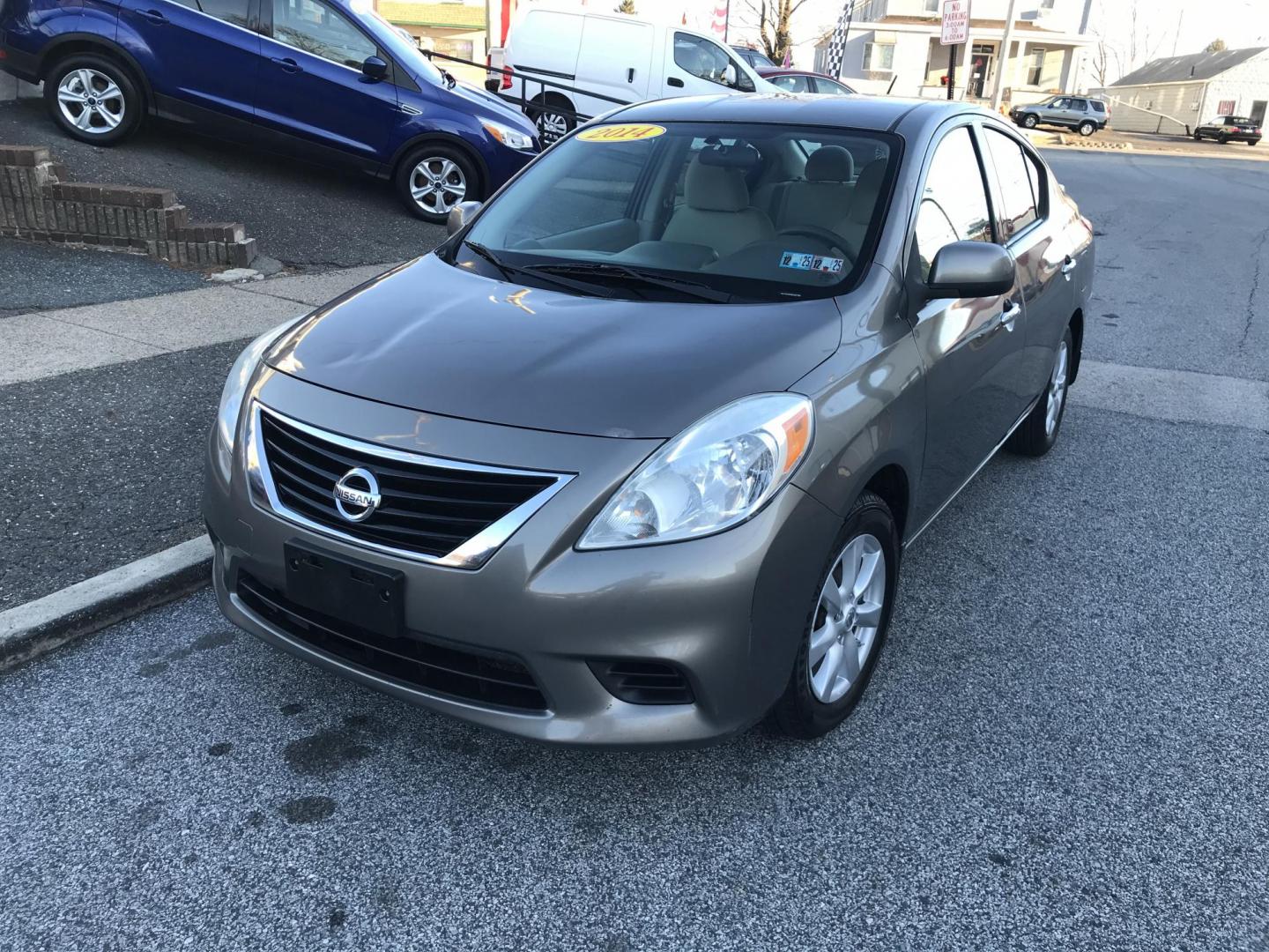 2014 Gray /Gray Nissan Versa 1.6 SV (3N1CN7AP4EL) with an 1.6L L4 DOHC 16V engine, Automatic transmission, located at 577 Chester Pike, Prospect Park, PA, 19076, (610) 237-1015, 39.886154, -75.302338 - Photo#2