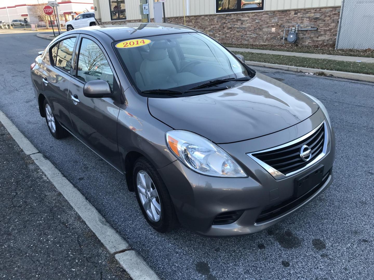 2014 Gray /Gray Nissan Versa 1.6 SV (3N1CN7AP4EL) with an 1.6L L4 DOHC 16V engine, Automatic transmission, located at 577 Chester Pike, Prospect Park, PA, 19076, (610) 237-1015, 39.886154, -75.302338 - Photo#3