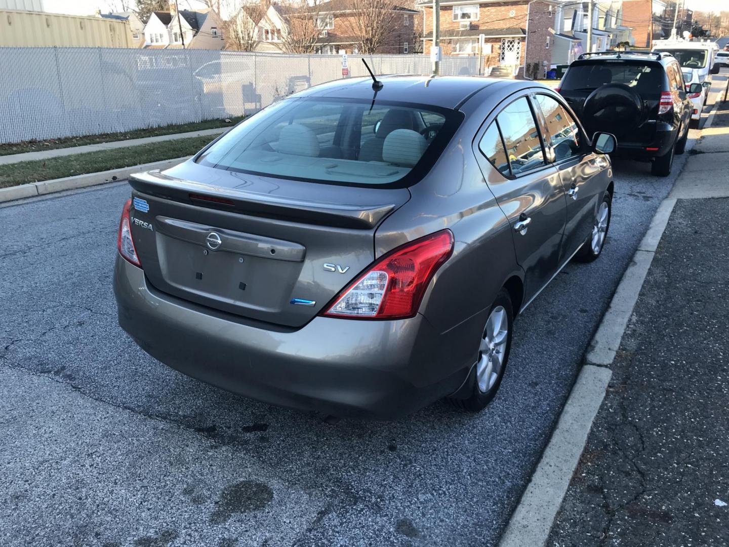 2014 Gray /Gray Nissan Versa 1.6 SV (3N1CN7AP4EL) with an 1.6L L4 DOHC 16V engine, Automatic transmission, located at 577 Chester Pike, Prospect Park, PA, 19076, (610) 237-1015, 39.886154, -75.302338 - Photo#4