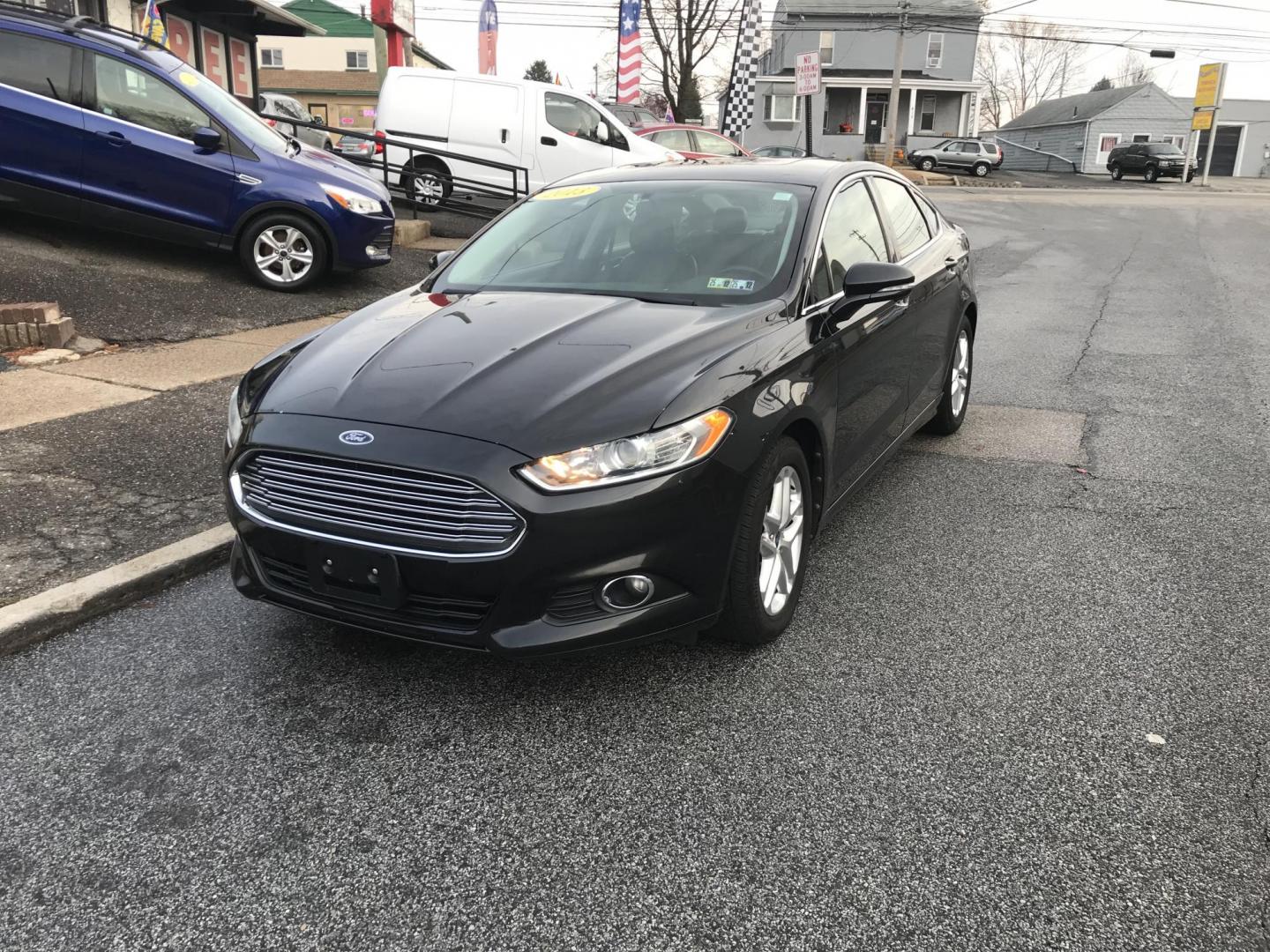 2013 Black /Black Ford Fusion SE (3FA6P0HR8DR) with an 1.6L L4 DOHC 16V engine, Automatic transmission, located at 577 Chester Pike, Prospect Park, PA, 19076, (610) 237-1015, 39.886154, -75.302338 - Photo#1