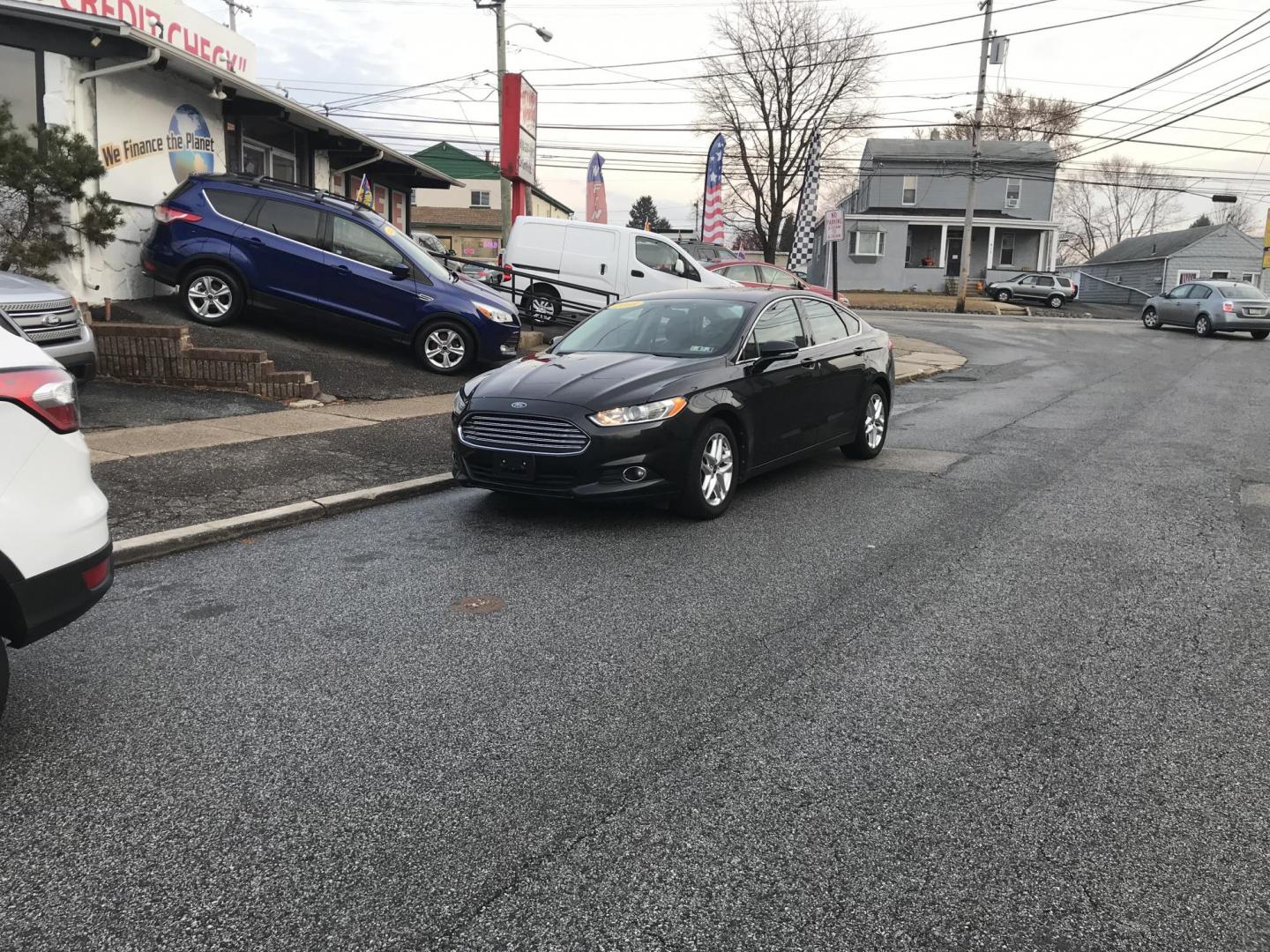 2013 Black /Black Ford Fusion SE (3FA6P0HR8DR) with an 1.6L L4 DOHC 16V engine, Automatic transmission, located at 577 Chester Pike, Prospect Park, PA, 19076, (610) 237-1015, 39.886154, -75.302338 - Photo#2