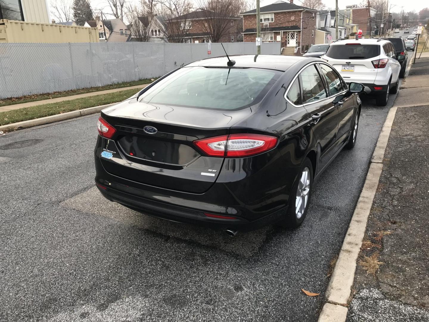 2013 Black /Black Ford Fusion SE (3FA6P0HR8DR) with an 1.6L L4 DOHC 16V engine, Automatic transmission, located at 577 Chester Pike, Prospect Park, PA, 19076, (610) 237-1015, 39.886154, -75.302338 - Photo#3