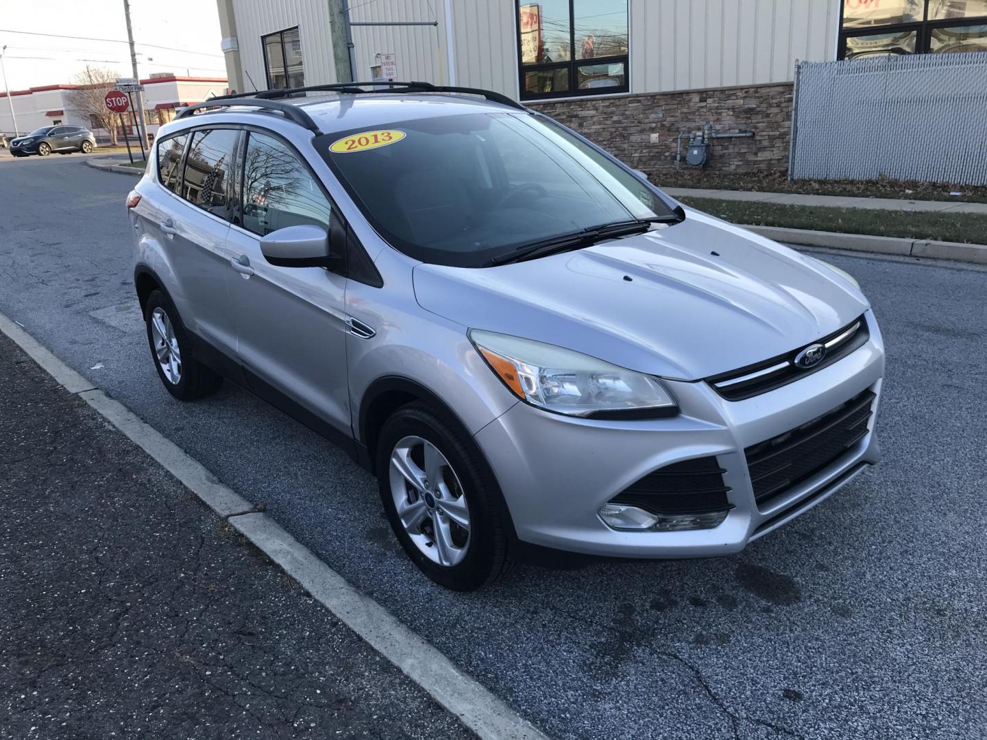 2013 Silver /Gray Ford Escape SE (1FMCU0GX9DU) with an 1.6L L4 DOHC 16V engine, 6-Speed Automatic transmission, located at 577 Chester Pike, Prospect Park, PA, 19076, (610) 237-1015, 39.886154, -75.302338 - Photo#3