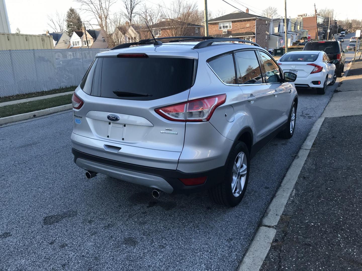 2013 Silver /Gray Ford Escape SE (1FMCU0GX9DU) with an 1.6L L4 DOHC 16V engine, 6-Speed Automatic transmission, located at 577 Chester Pike, Prospect Park, PA, 19076, (610) 237-1015, 39.886154, -75.302338 - Photo#5