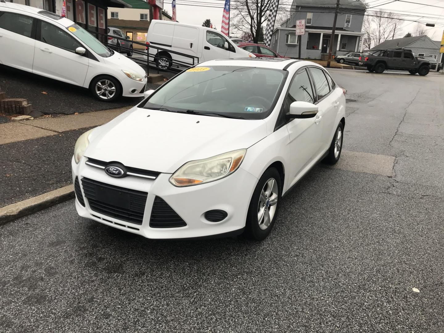 2013 White /Black Ford Focus SE Sedan (1FADP3F20DL) with an 2.0L L4 DOHC 16V engine, Automatic transmission, located at 577 Chester Pike, Prospect Park, PA, 19076, (610) 237-1015, 39.886154, -75.302338 - 2013 Ford Focus SE: Only 95k miles, sunroof, great on gas, new PA inspection, runs LIKE NEW! This vehicle comes inspected and has been given a bumper to bumper safety check. It is very clean, reliable, and well maintained. We offer a unique pay plan that is known for being the easiest and fastest - Photo#2