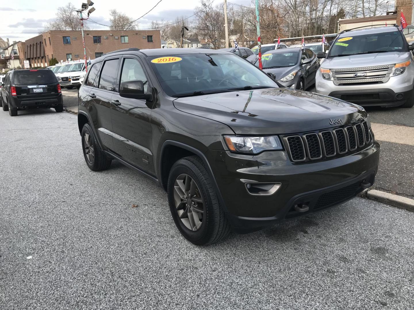 2016 Green /Black Jeep Grand Cherokee Laredo 4WD (1C4RJFAG0GC) with an 3.6L V6 DOHC 24V engine, 8A transmission, located at 577 Chester Pike, Prospect Park, PA, 19076, (610) 237-1015, 39.886154, -75.302338 - Photo#1