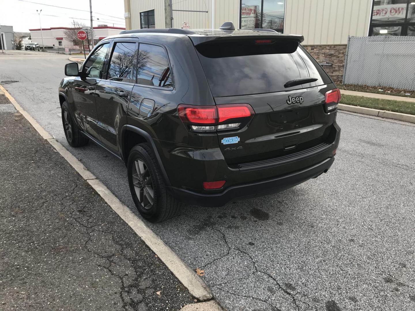 2016 Green /Black Jeep Grand Cherokee Laredo 4WD (1C4RJFAG0GC) with an 3.6L V6 DOHC 24V engine, 8A transmission, located at 577 Chester Pike, Prospect Park, PA, 19076, (610) 237-1015, 39.886154, -75.302338 - Photo#4