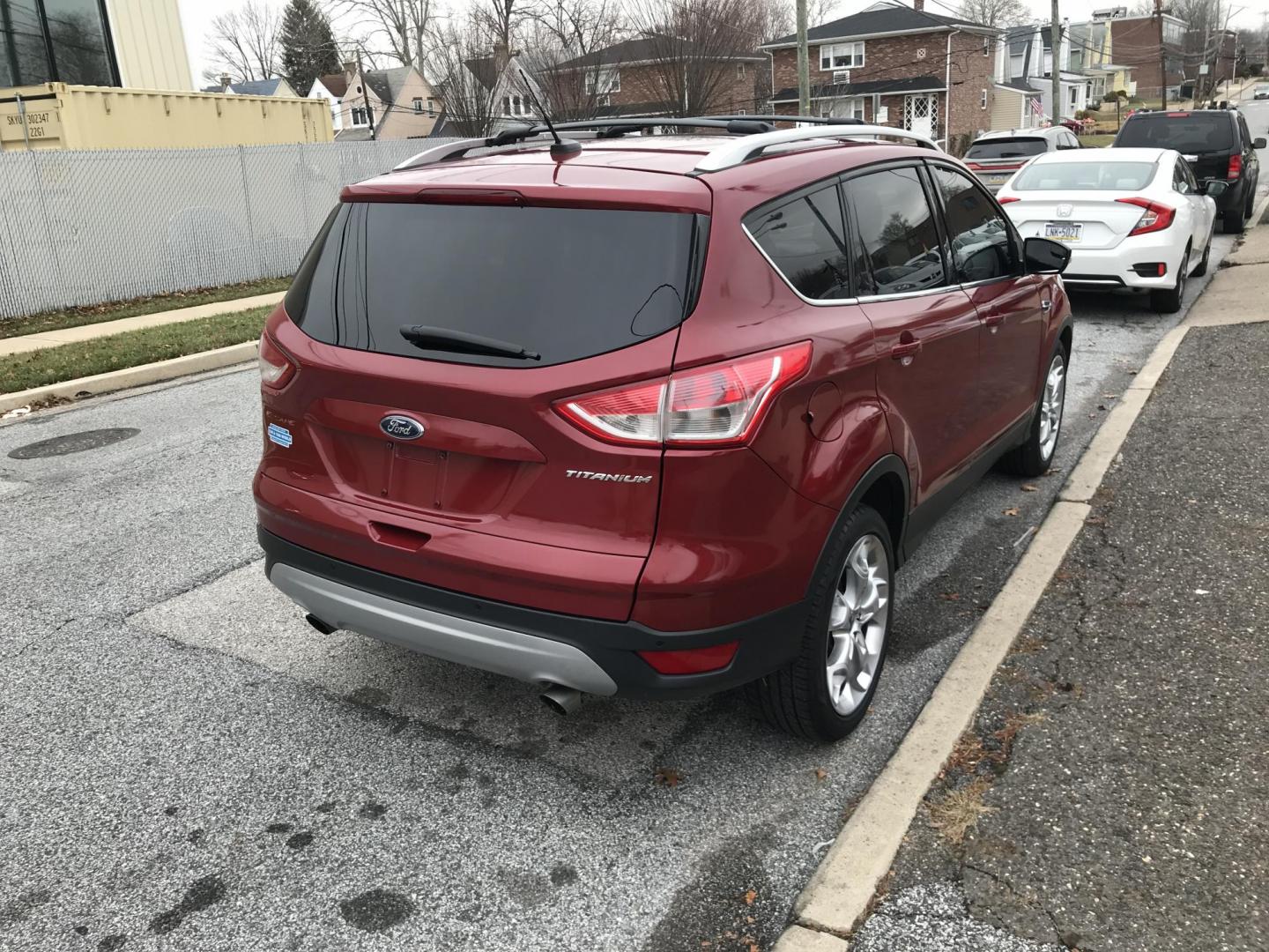 2013 Red /Black Ford Escape Titanium (1FMCU0J94DU) with an 2.0L L4 DOHC 16V engine, 6-Speed Automatic transmission, located at 577 Chester Pike, Prospect Park, PA, 19076, (610) 237-1015, 39.886154, -75.302338 - Photo#5