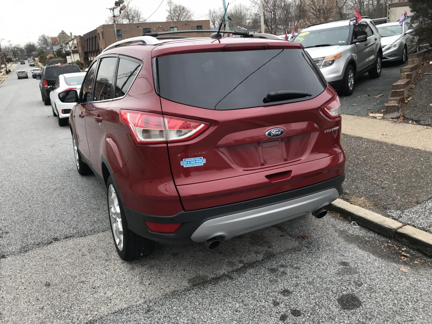 2013 Red /Black Ford Escape Titanium (1FMCU0J94DU) with an 2.0L L4 DOHC 16V engine, 6-Speed Automatic transmission, located at 577 Chester Pike, Prospect Park, PA, 19076, (610) 237-1015, 39.886154, -75.302338 - Photo#6