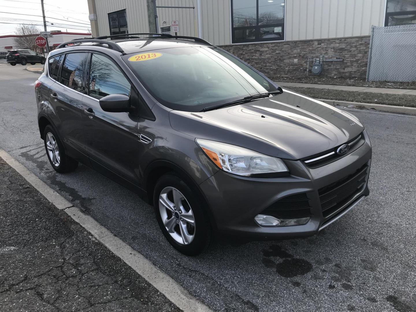 2013 Gray /Gray Ford Escape SE (1FMCU0GX3DU) with an 1.6L L4 DOHC 16V engine, 6-Speed Automatic transmission, located at 577 Chester Pike, Prospect Park, PA, 19076, (610) 237-1015, 39.886154, -75.302338 - Photo#2