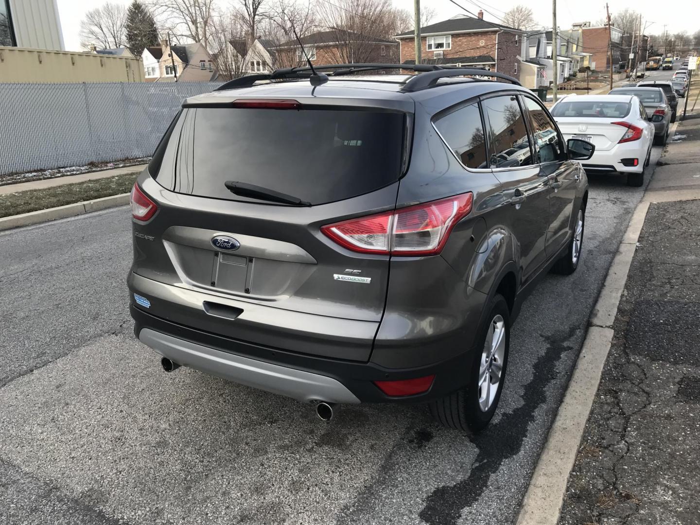 2013 Gray /Gray Ford Escape SE (1FMCU0GX3DU) with an 1.6L L4 DOHC 16V engine, 6-Speed Automatic transmission, located at 577 Chester Pike, Prospect Park, PA, 19076, (610) 237-1015, 39.886154, -75.302338 - Photo#5