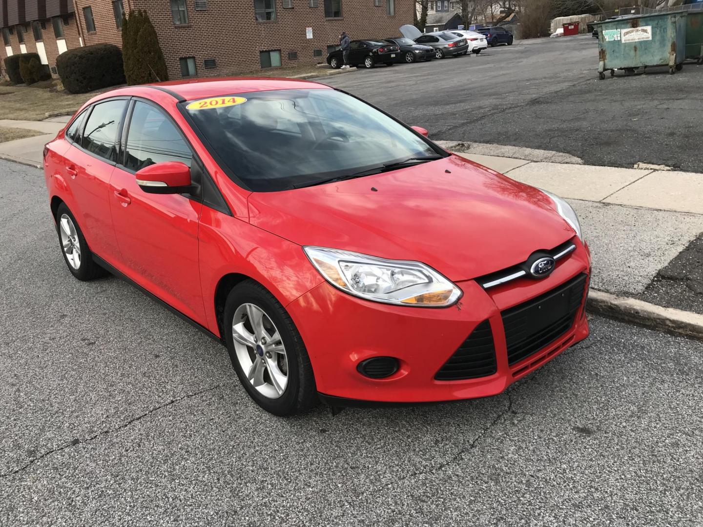 2014 Red /Black Ford Focus SE Sedan (1FADP3F21EL) with an 2.0L L4 DOHC 16V engine, Automatic transmission, located at 577 Chester Pike, Prospect Park, PA, 19076, (610) 237-1015, 39.886154, -75.302338 - 2014 Ford Focus: Only 80k miles, great on gas, new PA inspection, SUPER CLEAN, runs LIKE NEW! This vehicle comes inspected and has been given a bumper to bumper safety check. It is very clean, reliable, and well maintained. We offer a unique pay plan that is known for being the easiest and fastes - Photo#1