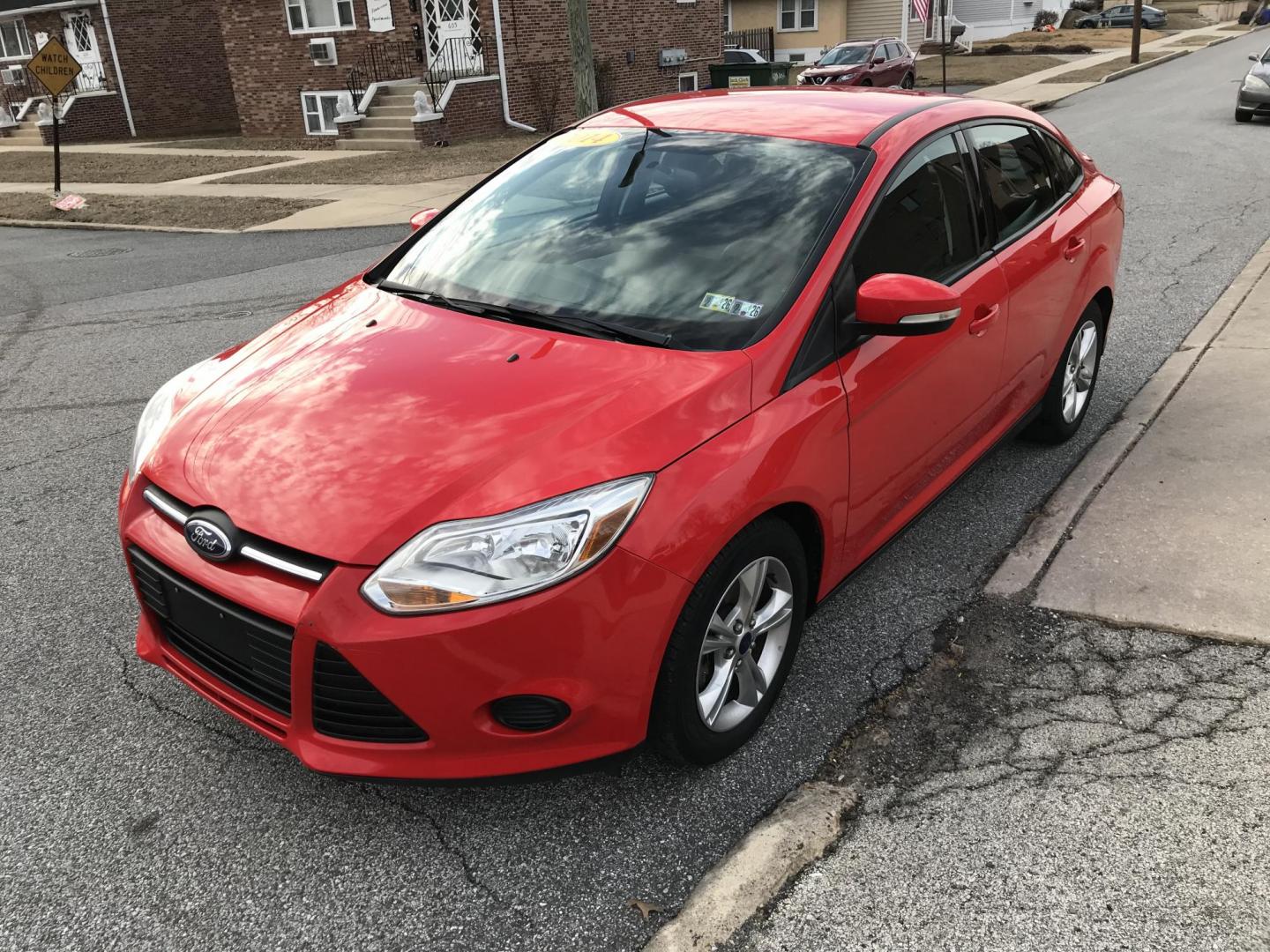 2014 Red /Black Ford Focus SE Sedan (1FADP3F21EL) with an 2.0L L4 DOHC 16V engine, Automatic transmission, located at 577 Chester Pike, Prospect Park, PA, 19076, (610) 237-1015, 39.886154, -75.302338 - 2014 Ford Focus: Only 80k miles, great on gas, new PA inspection, SUPER CLEAN, runs LIKE NEW! This vehicle comes inspected and has been given a bumper to bumper safety check. It is very clean, reliable, and well maintained. We offer a unique pay plan that is known for being the easiest and fastes - Photo#2