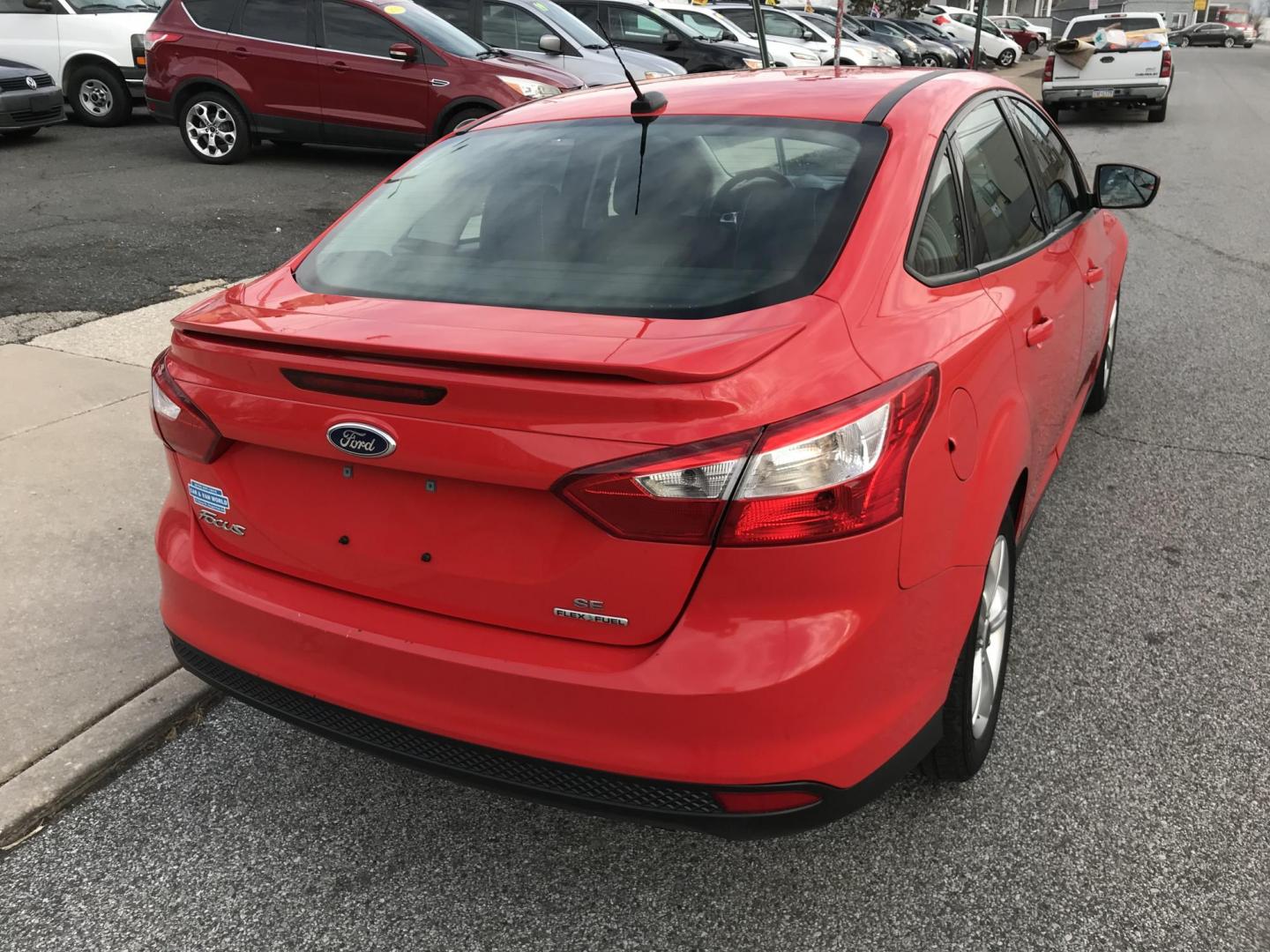 2014 Red /Black Ford Focus SE Sedan (1FADP3F21EL) with an 2.0L L4 DOHC 16V engine, Automatic transmission, located at 577 Chester Pike, Prospect Park, PA, 19076, (610) 237-1015, 39.886154, -75.302338 - 2014 Ford Focus: Only 80k miles, great on gas, new PA inspection, SUPER CLEAN, runs LIKE NEW! This vehicle comes inspected and has been given a bumper to bumper safety check. It is very clean, reliable, and well maintained. We offer a unique pay plan that is known for being the easiest and fastes - Photo#6