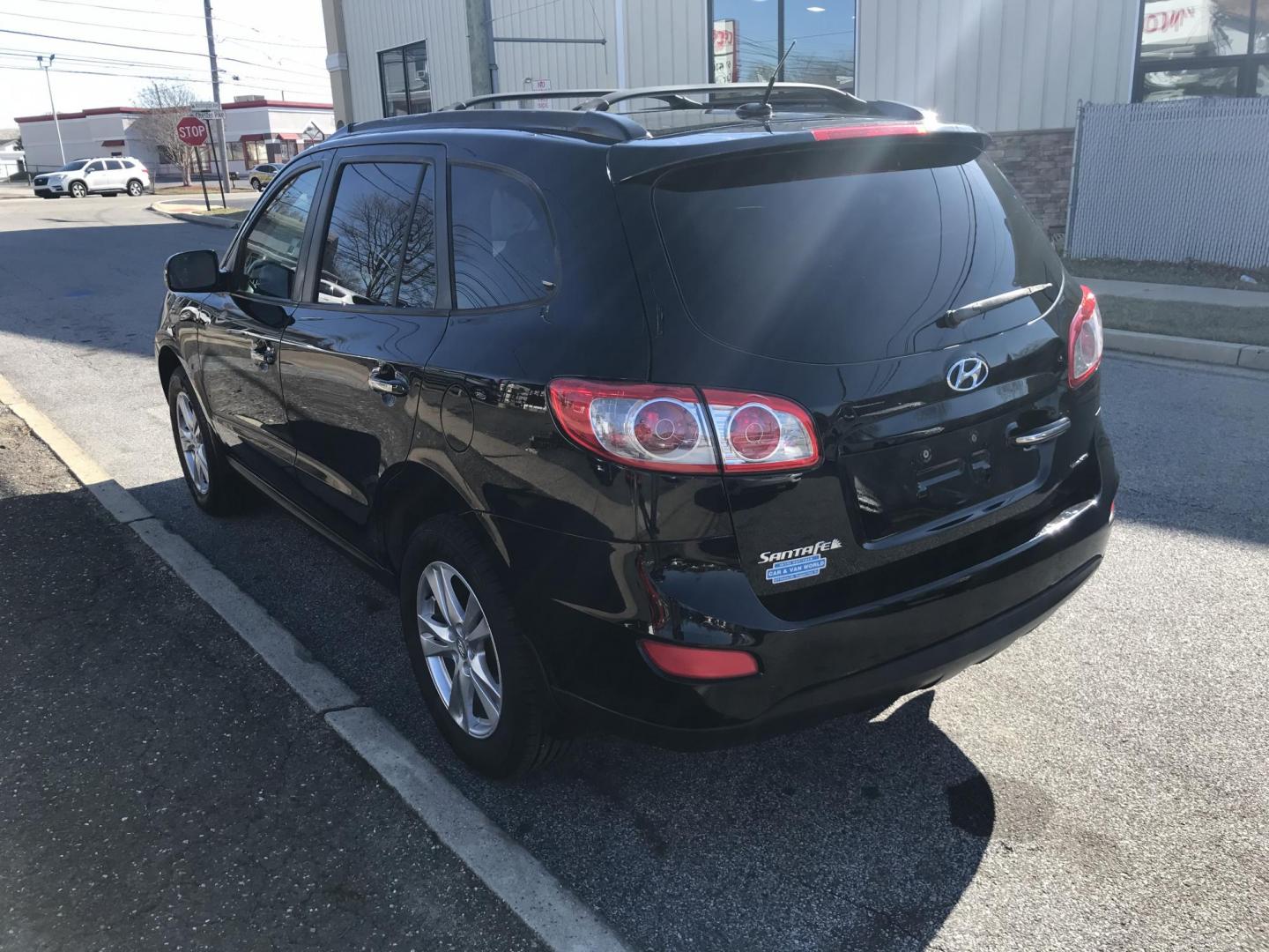 2012 Black /Tan Hyundai Santa Fe Limited 3.5 4WD (5XYZKDAG1CG) with an 3.5L V6 DOHC 24V engine, 6-Speed Automatic transmission, located at 577 Chester Pike, Prospect Park, PA, 19076, (610) 237-1015, 39.886154, -75.302338 - 2012 Hyundai Sant Fe LIMITED: 4x4, sunroof, new PA inspection, SUPER CLEAN, runs LIKE NEW! This vehicle comes inspected and has been given a bumper to bumper safety check. It is very clean, reliable, and well maintained. We offer a unique pay plan that is known for being the easiest and fastest f - Photo#9